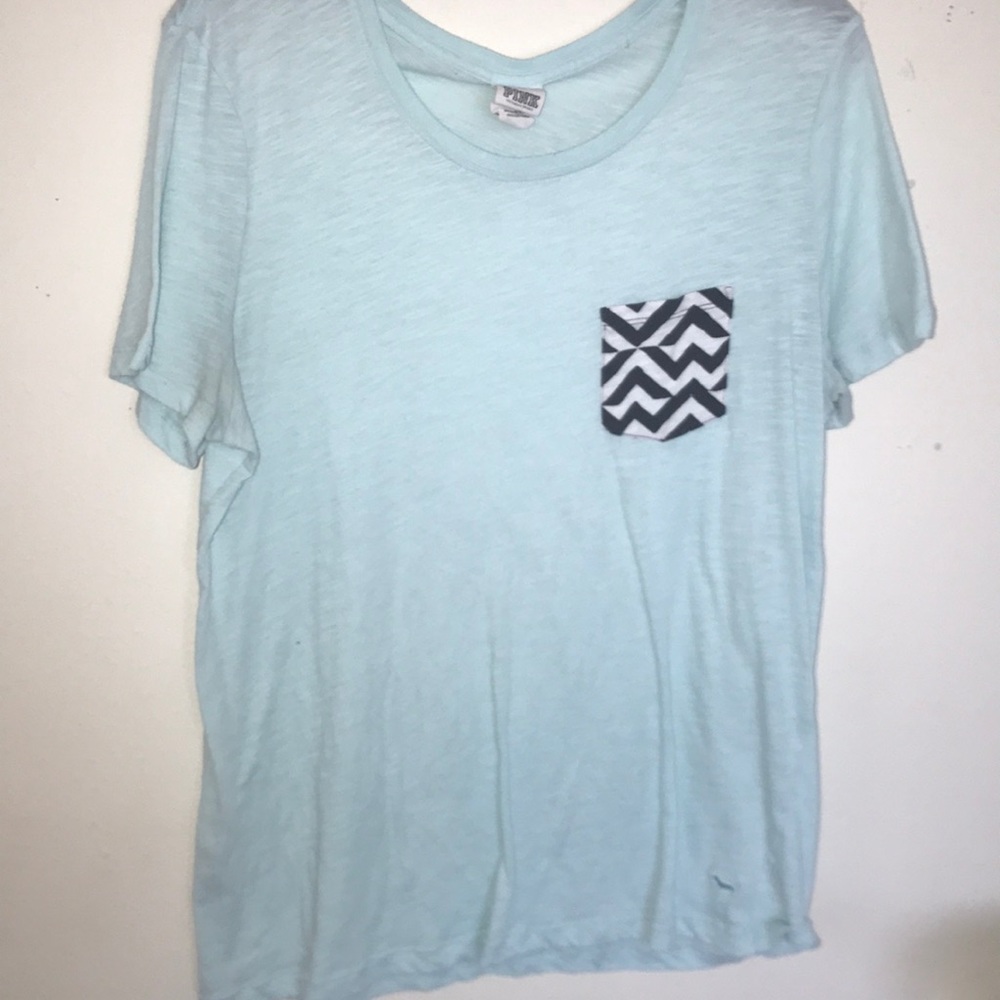 A blue tee with a black and white striped pocket